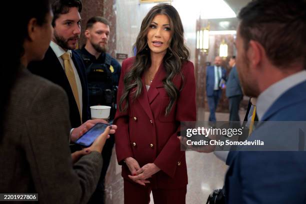 Department of Homeland Security Secretary Kristi Noem talks briefly with reporters after attending a Senate Homeland Security and Governmental...
