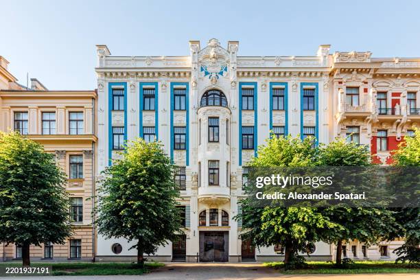 historic art nouveau apartment buildings in riga old town, wide angle view, latvia - riga stock-fotos und bilder