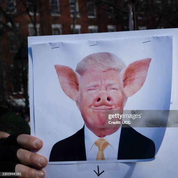 An image of Donald Trump, with his eyes shut and grinning but not showing his teeth - has been ludicrously modified to transform Trump into a hybrid...