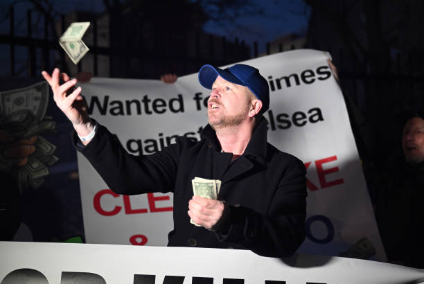 Fan of Chelsea is seen throwing dollar bills during a protest against BlueCo, the consortium Led by Chelsea Owner Todd Boehly, outside the stadium...