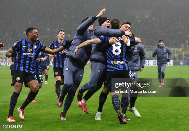 Marko Arnautovic of FC Internazionale celebrates scoring his team's first goal with teammates during the Coppa Italia Quarter Final match between FC...