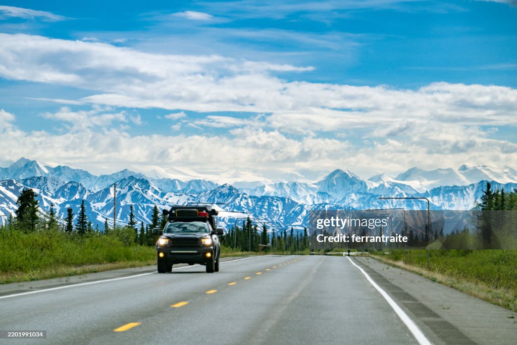 Pickup truck crossing a mountain pass in Alaska