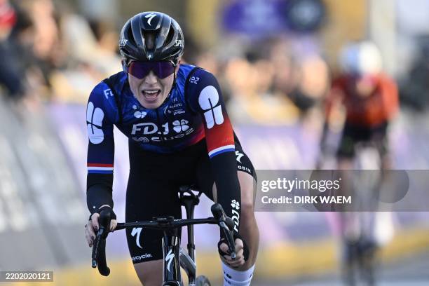 Dutch Demi Vollering of FDJ-Suez crosses the finish line of the women's one-day cycling race Omloop Het Nieuwsblad 9km from Gent to Ninove, Saturday...