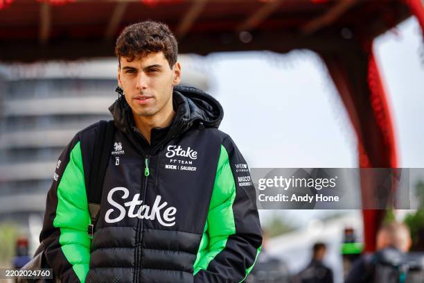 Gabriel Bortoleto of Brazil and Stake F1 Team Kick Sauber arrives in the Paddock during day one of F1 Testing at Bahrain International Circuit on...