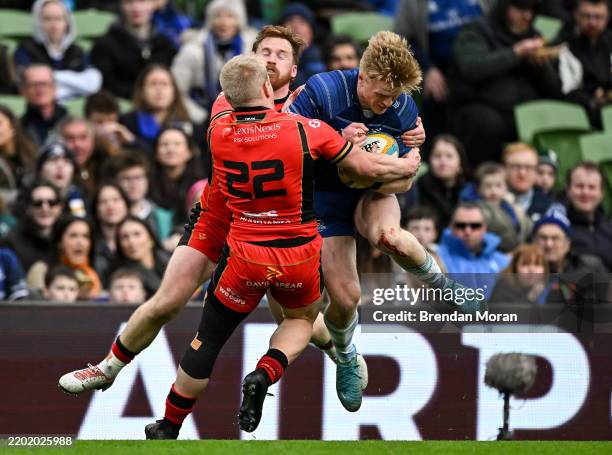 Dublin , Ireland - 1 March 2025; Tommy O'Brien of Leinster is tackled by Rory Jennings and Tinus de Beer of Cardiff during the United Rugby...