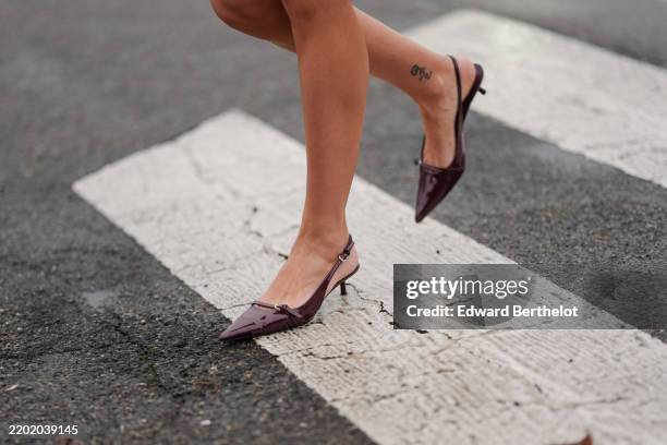 Guest wears shiny pointed toe burgundy bordeaux slingback leather shoes, outside Gucci, during the Milan Fashion week Men’s Fall/Winter 2025-2026 on...