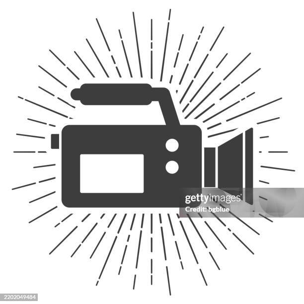 video camera. icon with sunbursts on white background - documentary filming stock illustrations