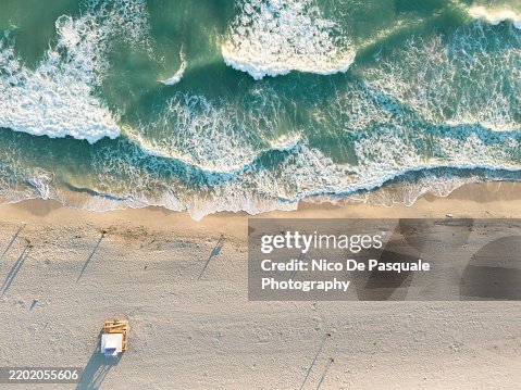 Dramatic Aerial View of Miami Beach Waves and Sand Dramatic Aerial View of Miami Beach Waves and Sand