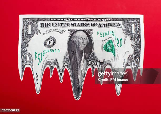 melting dollar - empire photos et images de collection
