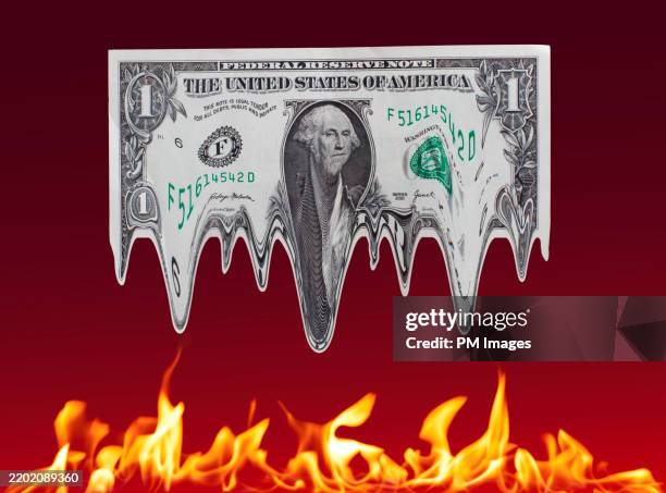 melting dollar over fire - economic depression stock pictures, royalty-free photos & images