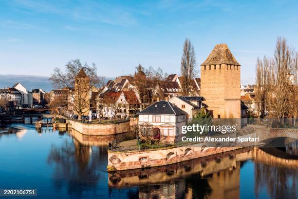 pont couverts bridge across l'ill river and strasbourg skyline on a sunny day, aerial view, strasbourg, france - pont couvert stock pictures, royalty-free photos & images