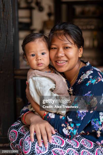 mother and baby from nepal - nepal family stock pictures, royalty-free photos & images