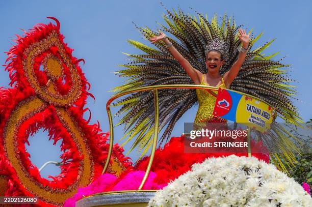 Carnival's queen Tatiana Angulo waves to the crowd during the Barranquilla's Carnival Batalla de Flores parade in Barranquilla, Colombia on March 1,...