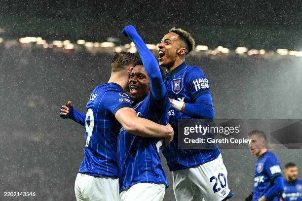 Jaden Philogene of Ipswich Town celebrates scoring his team's first goal with teammates Liam Delap and Omari Hutchinson during the Premier League...