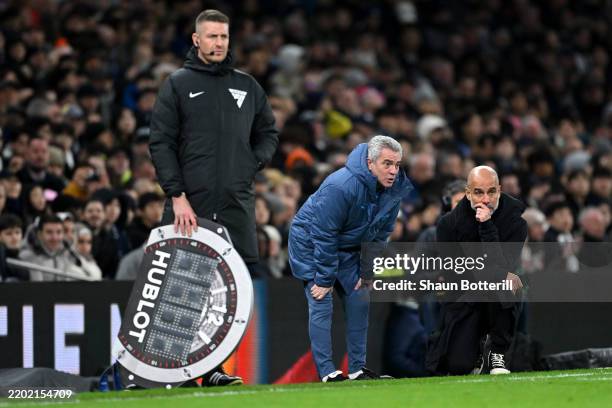 Juanma Lillo, Assistant Manager of Manchester City, talks to Pep Guardiola, Manager of Manchester City, during the Premier League match between...
