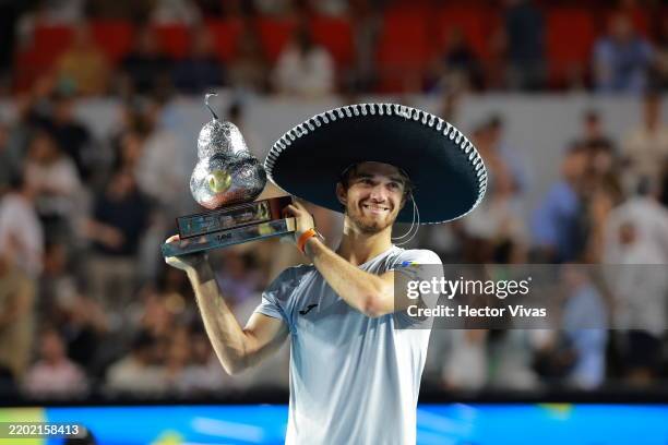 Tomas Machac of the Czech Republic celebrates with the champion trophy after winning the Men's Singles Final match against Alejandro Davidovich...
