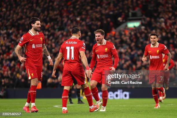 Alexis Mac Allister of Liverpool celebrates scoring his team's second goal with teammate Mohamed Salah during the Premier League match between...