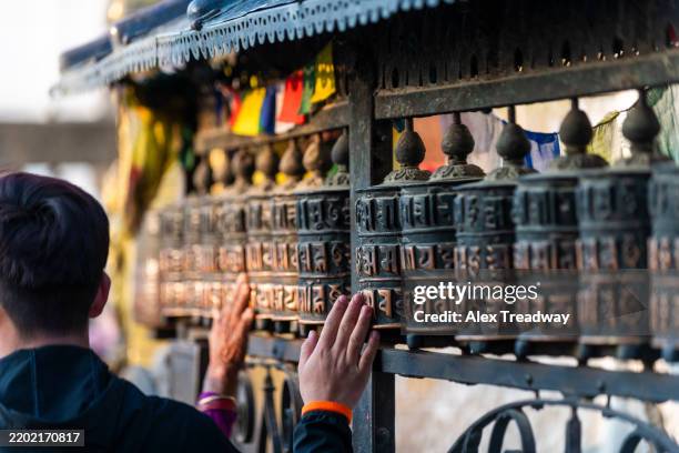 prayer wheels at monkey temple in kathmandu - swayambhunath stock pictures, royalty-free photos & images