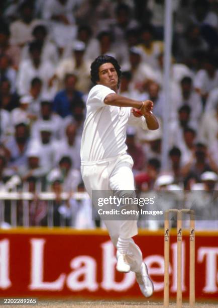 Pakistan bowler Wasim Akram in bowling action during a match in Sharjah in 1987.