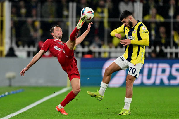 Oguz Aydin of Fenerbahce in action against Bunyamin Balci of ONVO Antalyaspor during the Turkish Super Lig week 26 football match between Fenerbahce...
