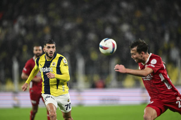 Oguz Aydin of Fenerbahce in action against Van de Streek of ONVO Antalyaspor during the Turkish Super Lig week 26 football match between Fenerbahce...