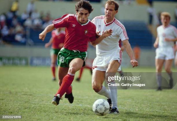 Paulo Futre of Portugal is challenged by Krzysztof Pawlak of Poland during the 1986 FIFA World Cup match on June 7th, 1986 in Monterrey, Mexico.