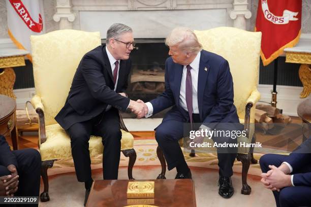 British Prime Minister Keir Starmer shakes hands with U.S. President Donald Trump as they meet in the Oval Office at the White House on February 27,...
