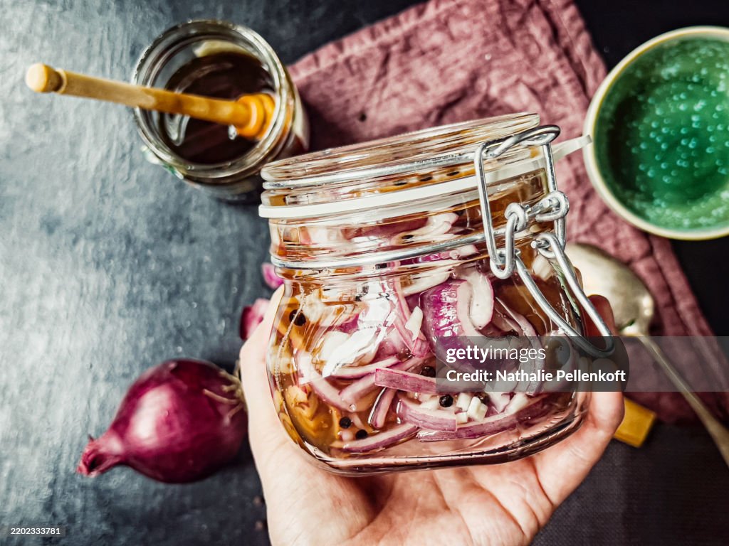 Preparing pickled onion in kitchen