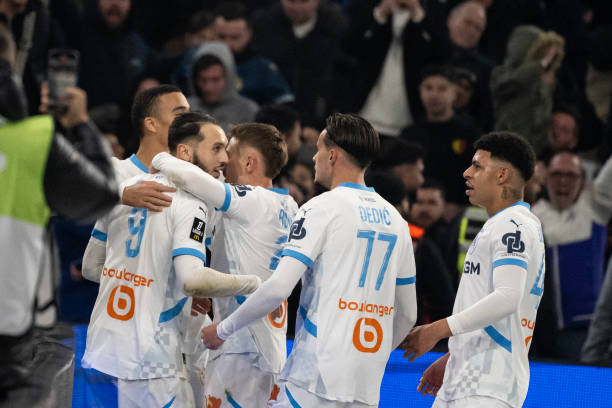 Marseille's Algerian forward Amine Gouiri celebrates with teammates after scoring a goal during the French L1 football match between Olympique de...