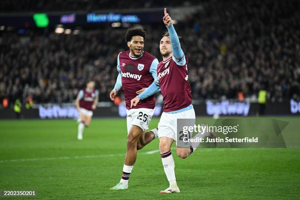 Jarrod Bowen and Jean-Clair Todibo of West Ham United celebrate their team's second goal, an own goal scored by Jannik Vestergaard of Leicester City...