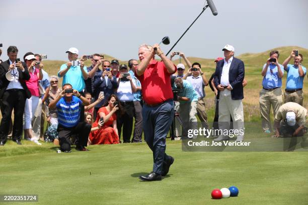 Jack Nicklaus hits a drive while Donald Trump looks on at the opening of the former Trump Links at Ferry Point Park in The Bronx, New York City, New...