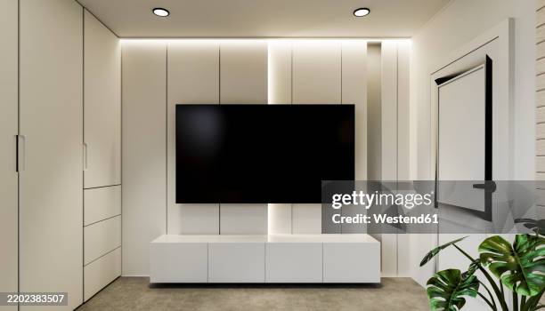 television set on white wall in bedroom - tv on wall stock illustrations