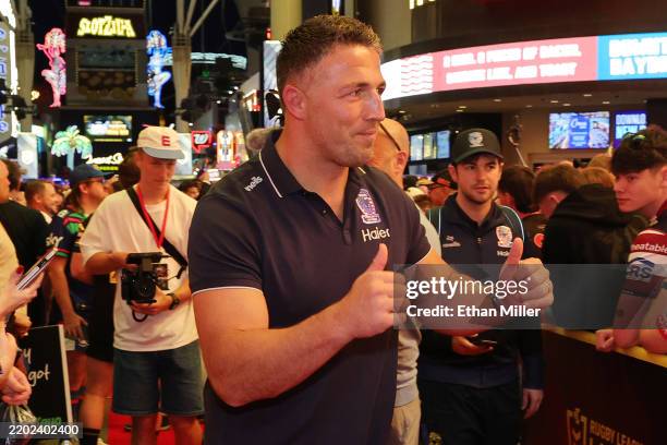 Head coach of the Warrington Wolves Sam Burgess greets spectators during an NRL fan event at the Fremont Street Experience on February 27, 2025 in...