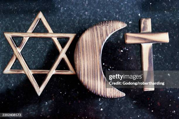 christianity, islam and judaism symbols, three monotheistic religions, jewish star of david, christian cross and muslim crescent, indonesia - judentum stock-fotos und bilder