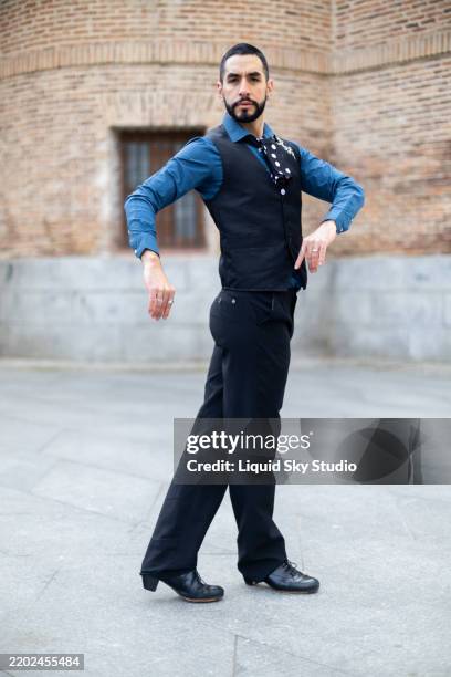 flamenco dancer performing outdoors with elegance and passion - flamenco stock pictures, royalty-free photos & images