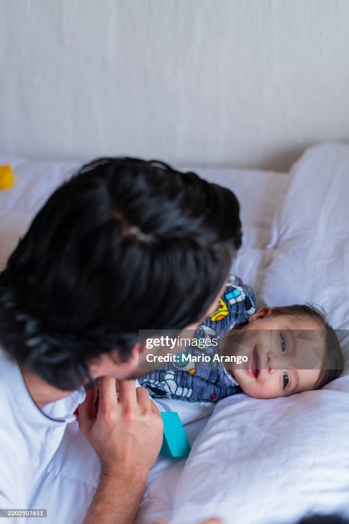 A morning at home with dad, playing on the couch at home