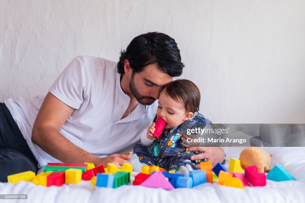A morning at home with dad, playing on the couch at home