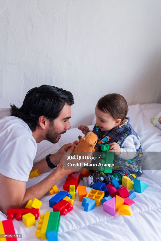 A morning at home with dad, playing on the couch at home
