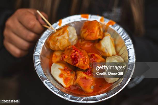 dumplings (momos) for sale near patan durbar square in kathmandu, nepal. - nepal food stock pictures, royalty-free photos & images