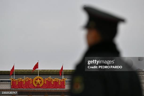 Chinese People's Liberation Army soldier stands guard in front of the National Museum of China in Beijing on March 3 ahead of the country's annual...