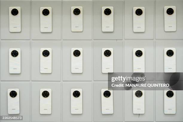 Realme 14 Pro+ mobile phones are displayed during the MWC , the world's biggest mobile fair, in Barcelona on March 3, 2025. Surrounded by investment...
