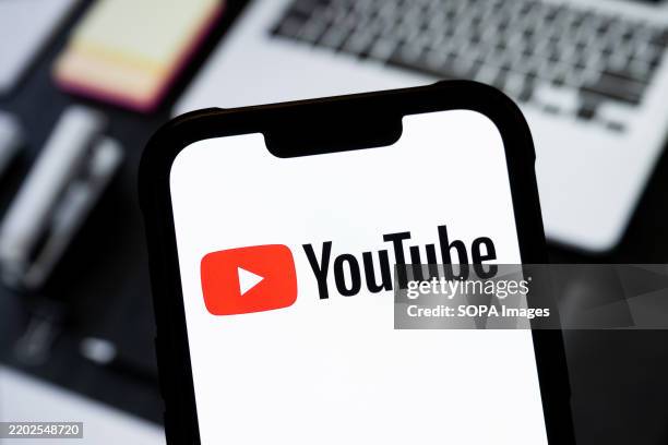 In this photo illustration, a YouTube logo seen displayed on a smartphone.