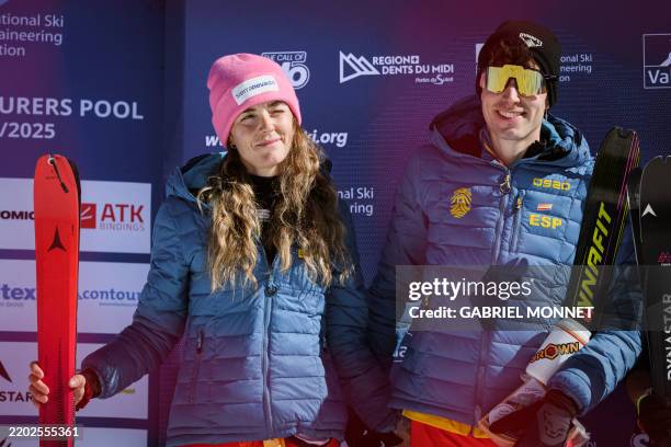 Spain's Ana Alonso Rodriguez and Oriol Cardona Coll celebrate their second place during the victory ceremony of the Mixed Relay event at the Ski...