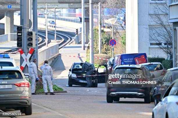 Forensic officers examine a damaged car at the site of a car ramming attack in Mannheim, southwestern Germany on March 3, 2025. A car driven into a...