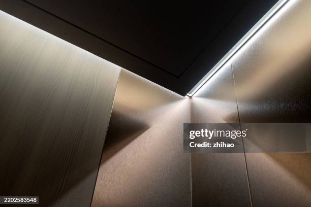 metallic corridor with linear lighting - inside elevator stock pictures, royalty-free photos & images