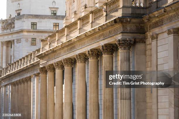 façade of the bank of england, threadneedle street, city of london at dusk - historic building stock pictures, royalty-free photos & images