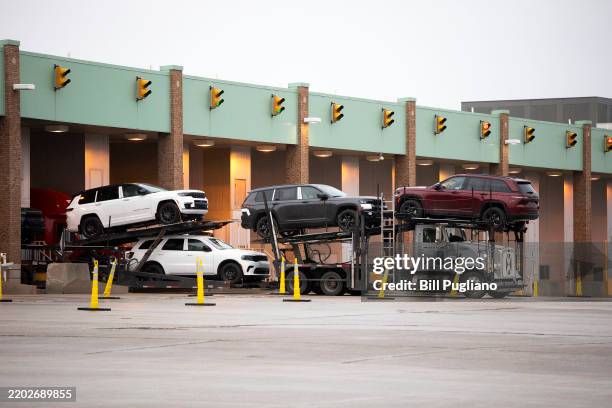 Car hauler goes through Customs after crossing the Ambassador Bridge from Detroit, Michigan to Windsor, Canada on the first day of President Donald...
