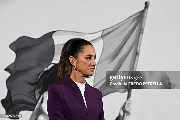 Mexico's President Claudia Sheinbaum gestures while announcing that Mexico will hit back at US President Donald Trump's tariffs with retaliatory...