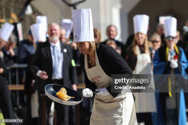 People take part in the annual pancake race as part of the Shrove Tuesday tradition in London, United Kingdom on March 04, 2025. Competitors competed...