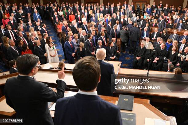 Representative Al Green shouts as US President Donald Trump delivers his address to a joint session of Congress, flanked by US Speaker of the House...